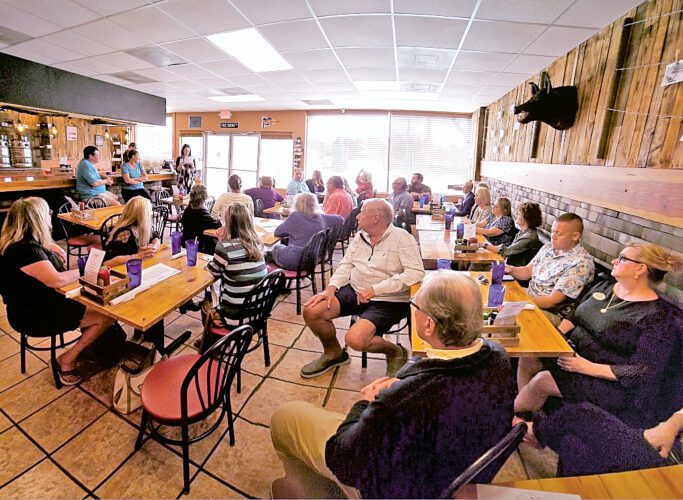 Pine Island Realtors host unity meeting at Fine Swine News, Sports